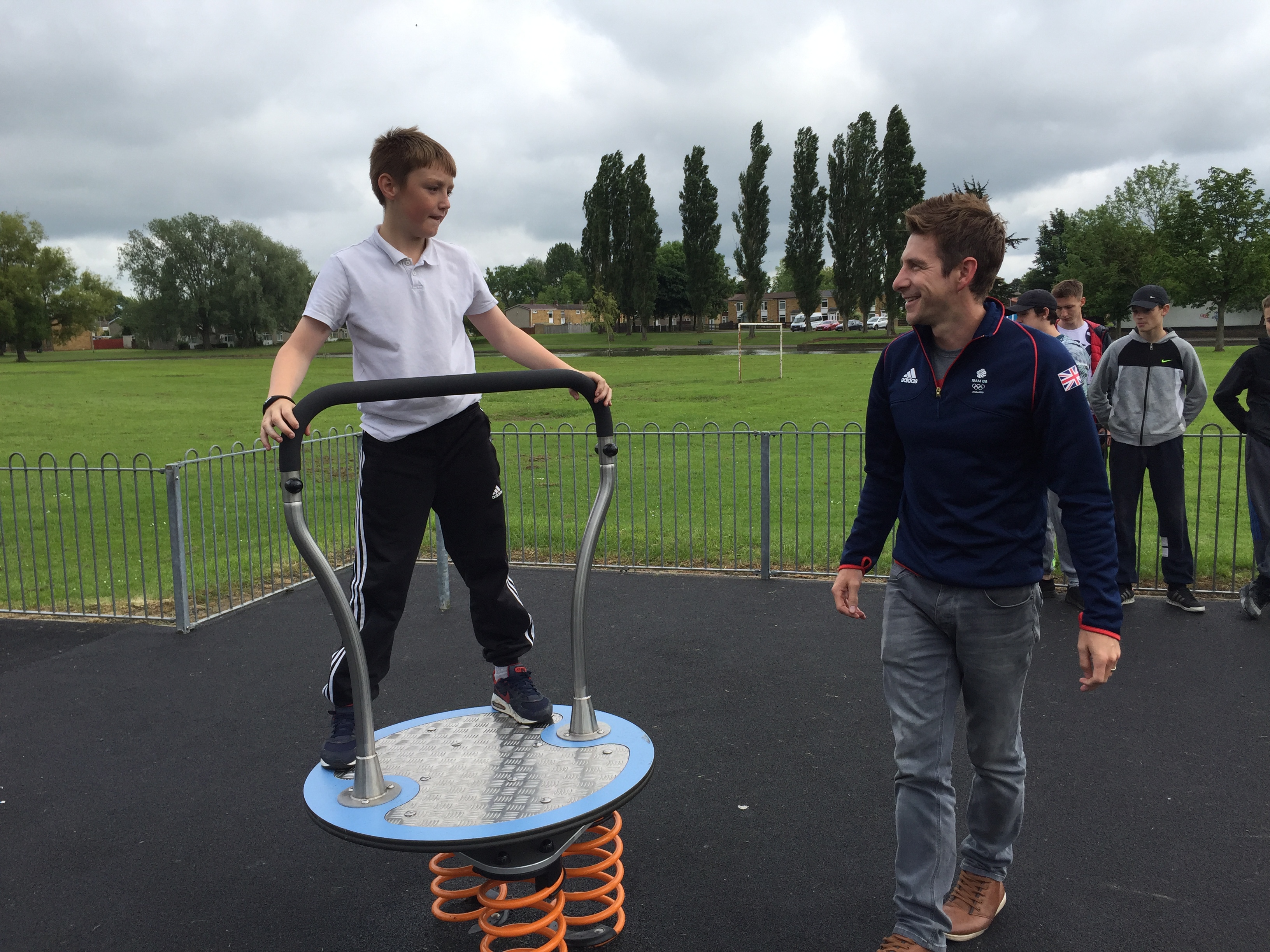 School Boy playing on Proludic Adventure Play Children's Play Equipment at West Park