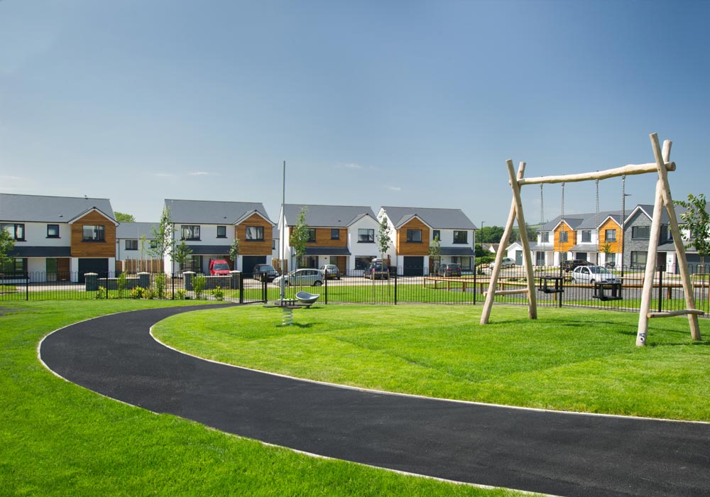 Proludic natural wooden outdoor playground equipment on a housing estate