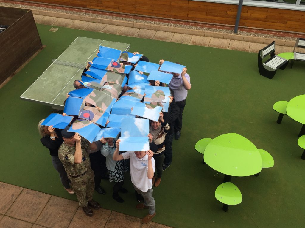 Proludic's completed spitfire for RAF100 held aloft by team