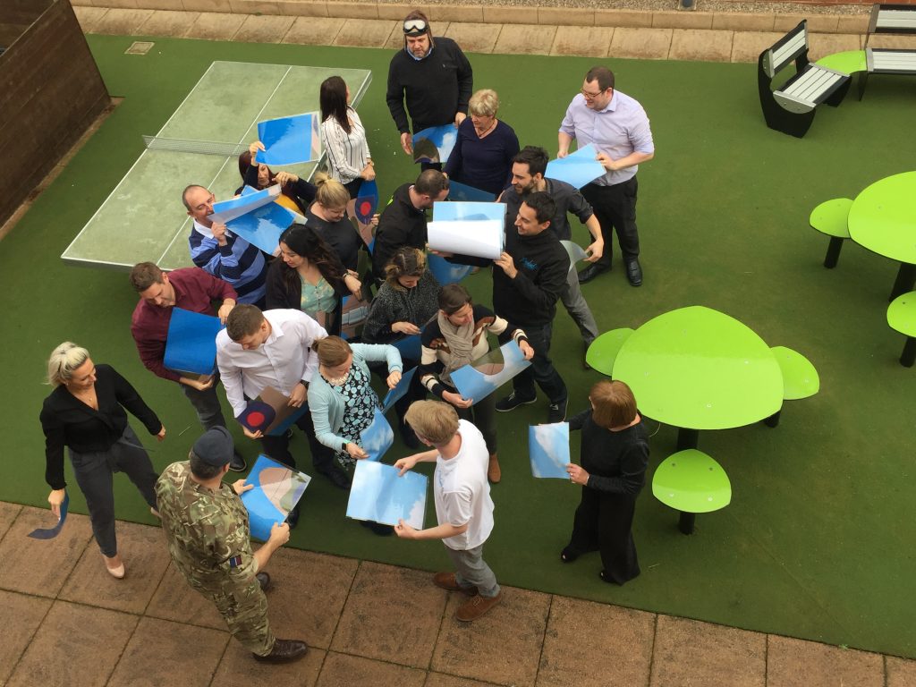 Proludic team problem solving puzzle outside birds eye view