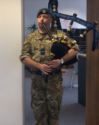 #SpicyPiper RAF playing on bagpipes close crop