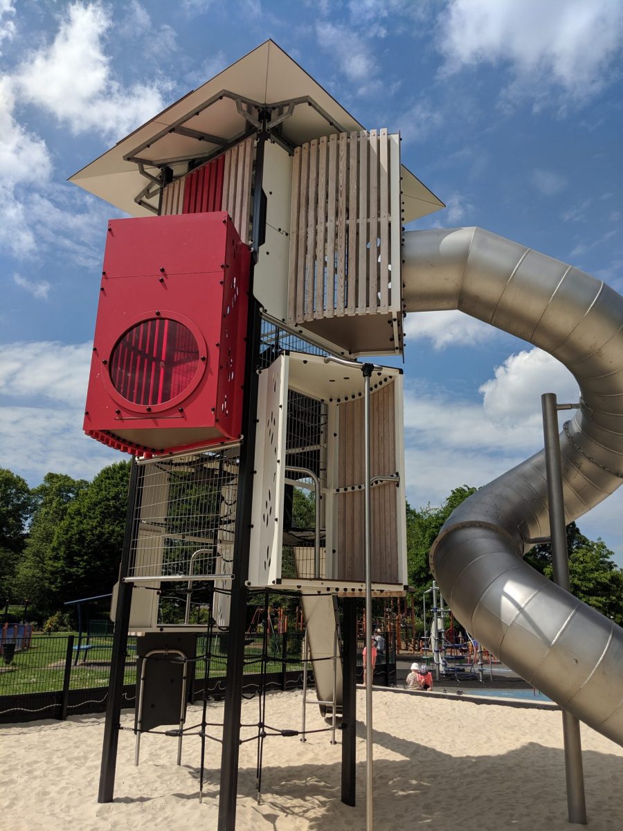 The Taunton lighthouse tower at Victoria Park. A red and white creative play tower with covered metal slide.