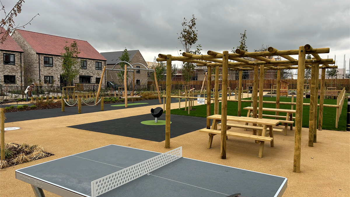 Table tennis table, benches, and play equipment at Springstead Village Play Area